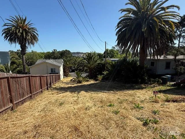 a view of a swimming pool with a yard