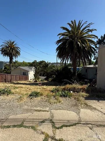 a view of house with outdoor space and swimming pool