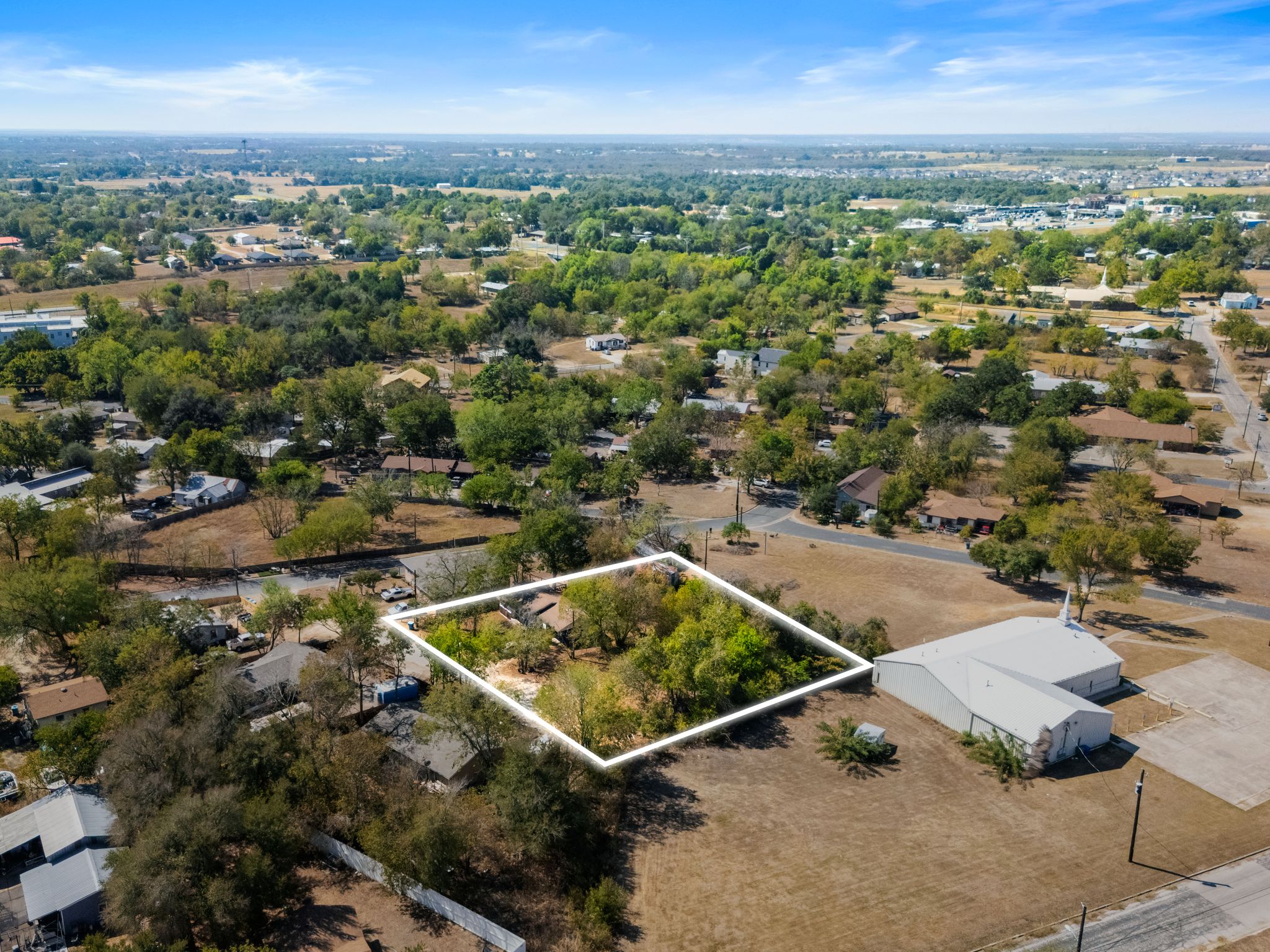 102 Masonic Drive Elgin, TX 78621 - Photo 3 of 12 an aerial view of residential houses with outdoor space