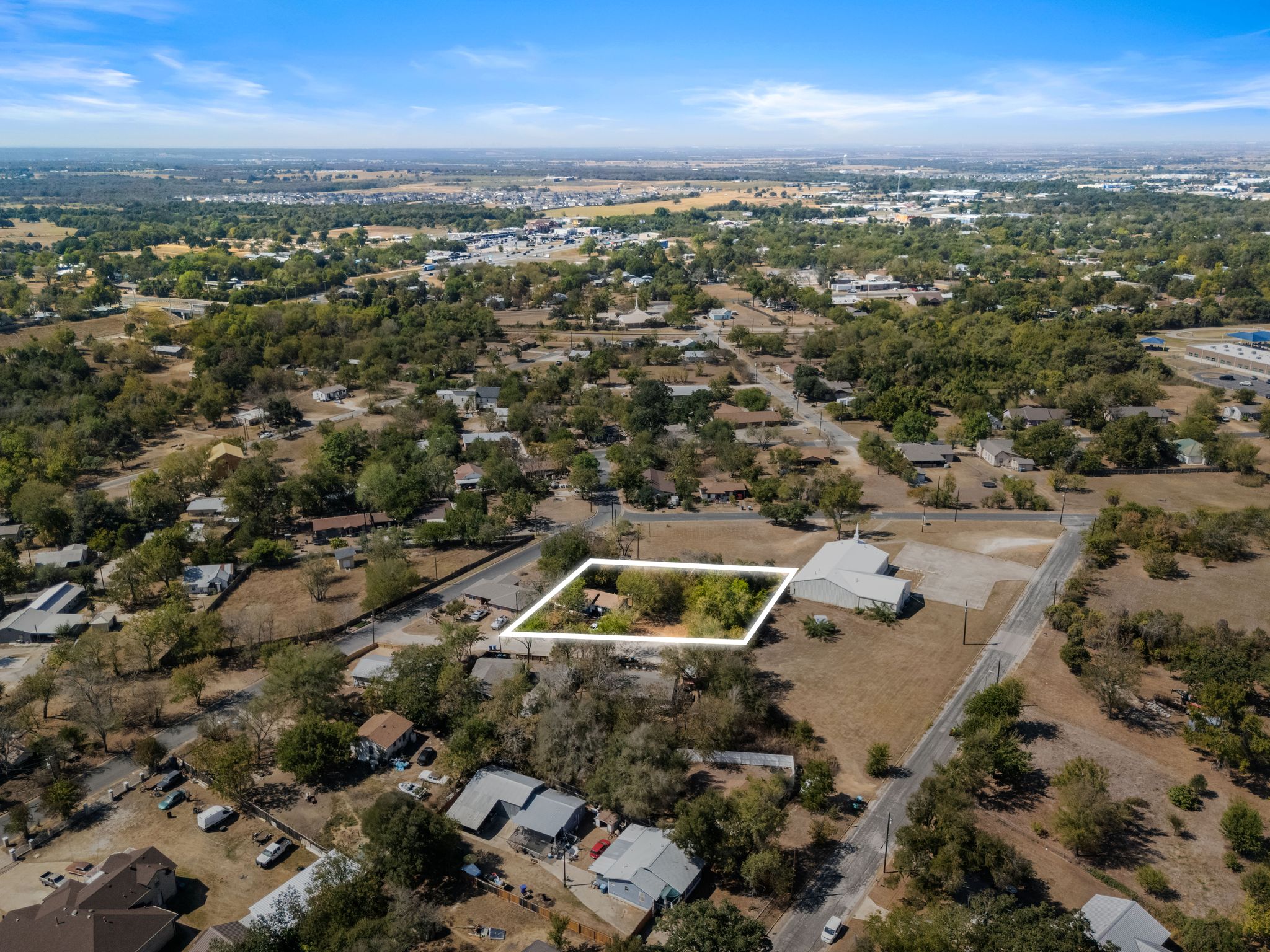 102 Masonic Drive Elgin, TX 78621 - Photo 7 of 12 an aerial view of residential houses with outdoor space
