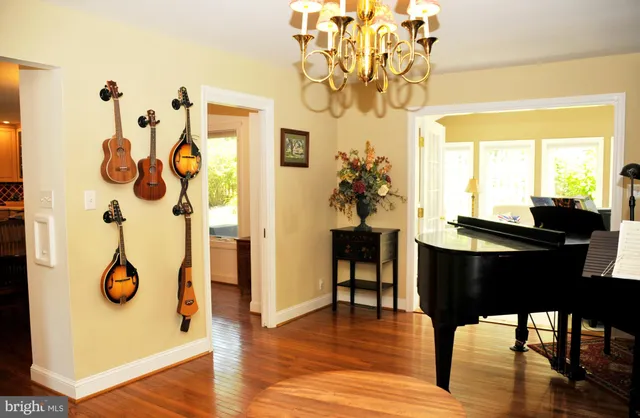 a living room with furniture a rug and a book shelf