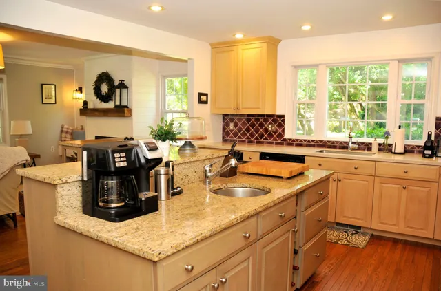 a living room with furniture fireplace and window