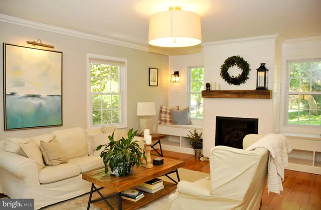 a large bed in a bedroom next to a window