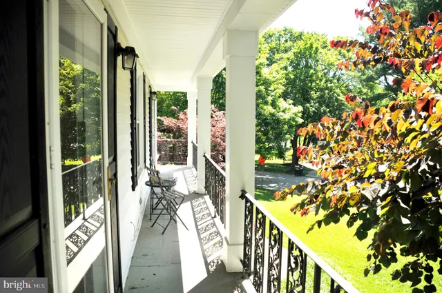 a view of balcony with wooden floor and outdoor space