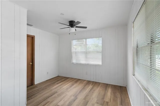 a view of room window and wooden floor