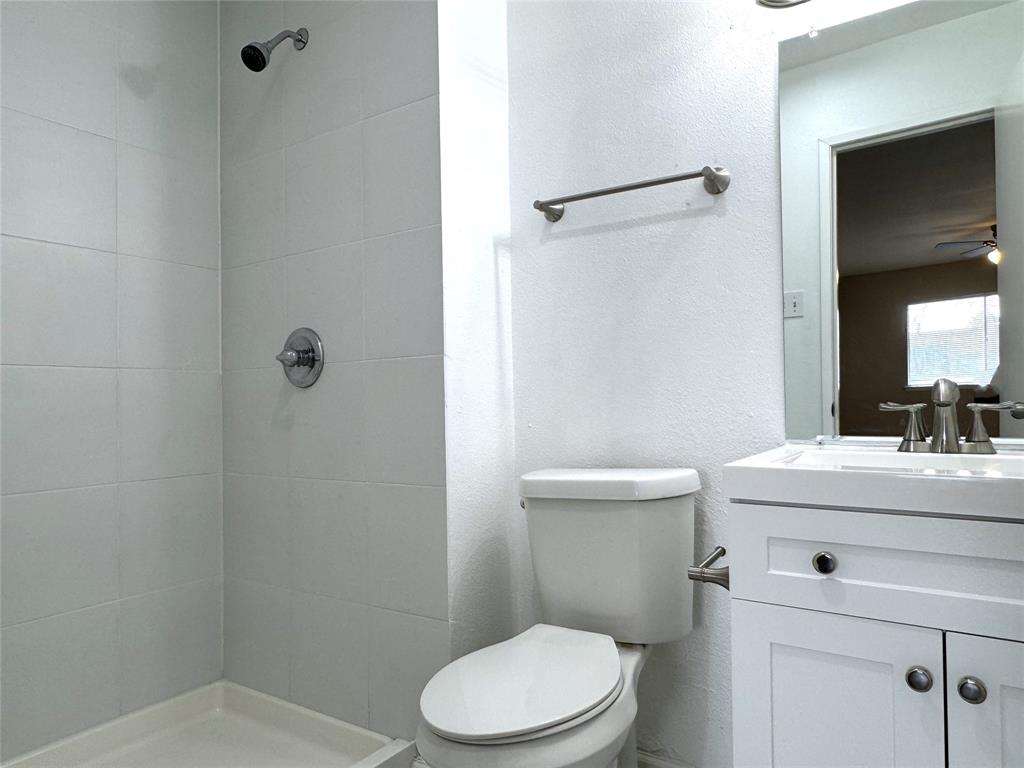 1612 Fairfield Drive Plano, TX 75074 - Photo 16 of 21 Primary bathroom has Corian countertops and built-in cabinets.