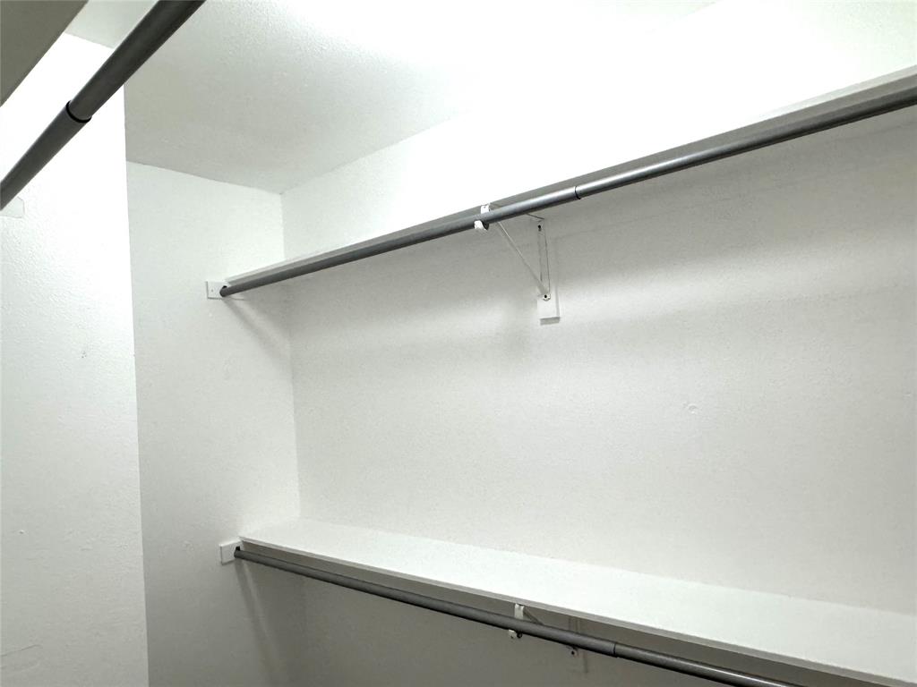 1612 Fairfield Drive Plano, TX 75074 - Photo 17 of 21 Primary bedroom walk-in closet.