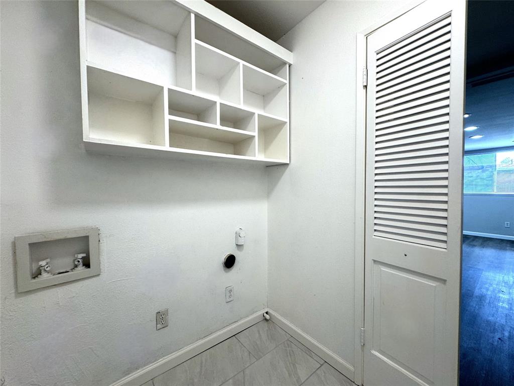 1612 Fairfield Drive Plano, TX 75074 - Photo 18 of 21 The utility room is located between the kitchen and the garage. It is large enough to fit a full-size washer and drier (electric hook-up).