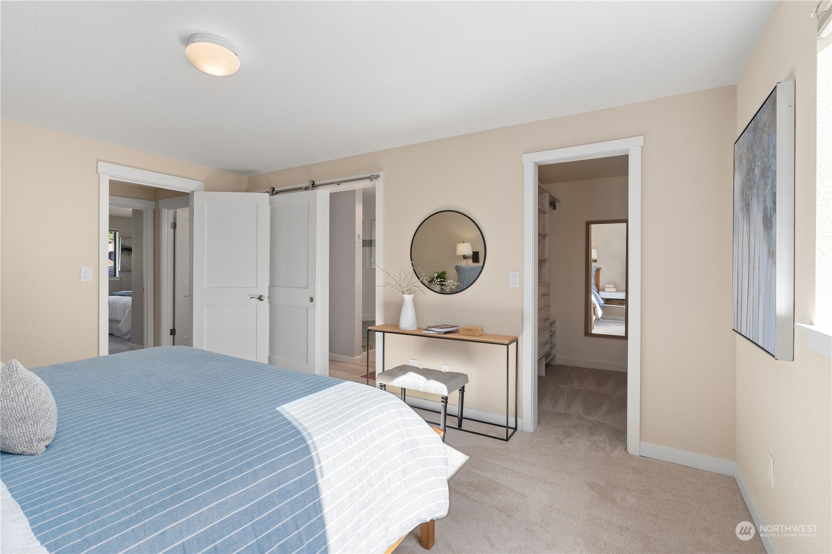 2402 169th Place Southeast Bothell, WA 98012 - Photo 18 of 38 a bedroom with a bed and a chandelier