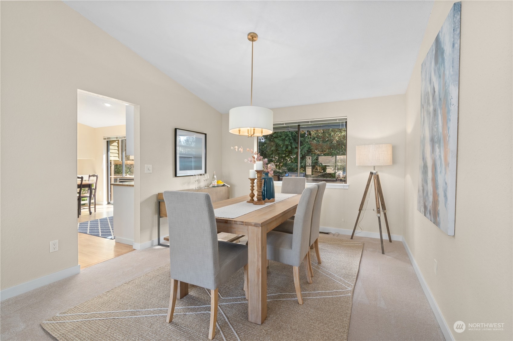 2402 169th Place Southeast Bothell, WA 98012 - Photo 9 of 38 a dining room with furniture a chandelier and wooden floor