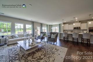 2973 Findley Road, Unit BF6 202 Statesville, NC 28625 - Photo 11 of 34 a living room with furniture wooden floor and a table