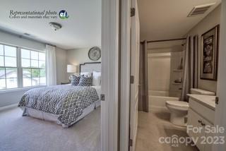 2973 Findley Road, Unit BF6 202 Statesville, NC 28625 - Photo 14 of 34 a bedroom with a bed and glass window