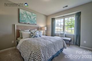 2973 Findley Road, Unit BF6 202 Statesville, NC 28625 - Photo 15 of 34 a bedroom with a large bed and a window