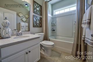 2973 Findley Road, Unit BF6 202 Statesville, NC 28625 - Photo 18 of 34 a bathroom with a granite countertop sink toilet and shower