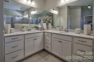 2973 Findley Road, Unit BF6 202 Statesville, NC 28625 - Photo 21 of 34 a bathroom with double sink and a mirror