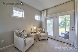 2973 Findley Road, Unit BF6 202 Statesville, NC 28625 - Photo 25 of 34 a living room with furniture and a floor to ceiling window