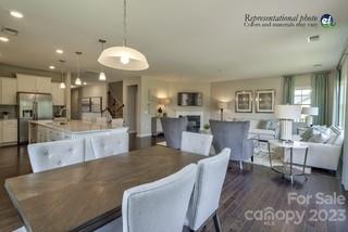 2973 Findley Road, Unit BF6 202 Statesville, NC 28625 - Photo 6 of 34 a view of a dining room with furniture and wooden floor