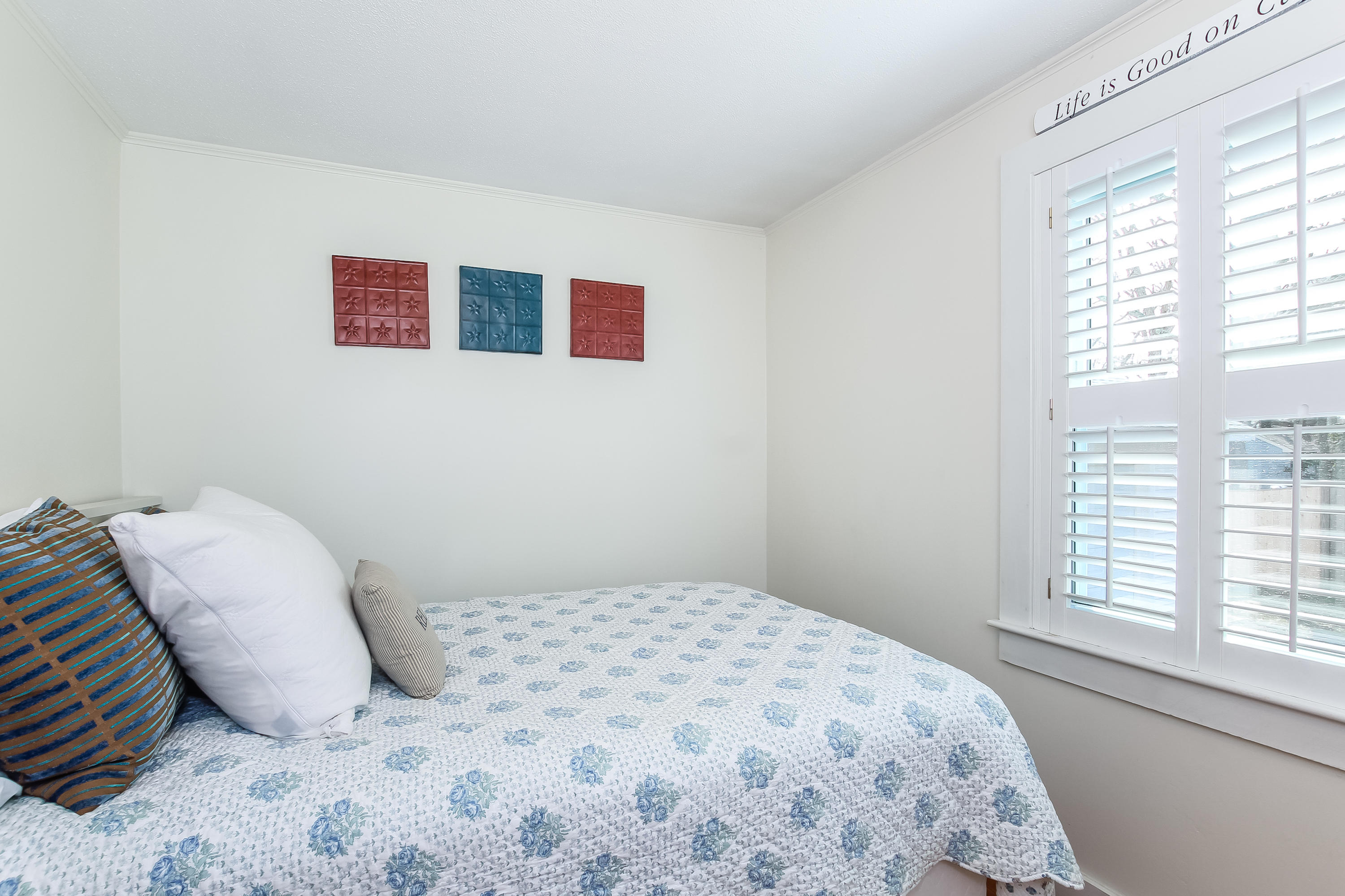 348 Strawberry Hill Road Centerville, MA 02632 - Photo 23 of 32 a bedroom with a bed and a window