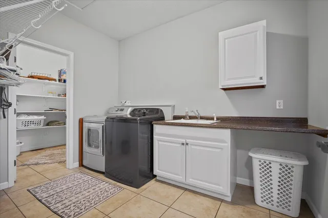 a kitchen with stainless steel appliances granite countertop a refrigerator and a stove