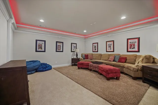 a living room with furniture and a dining table