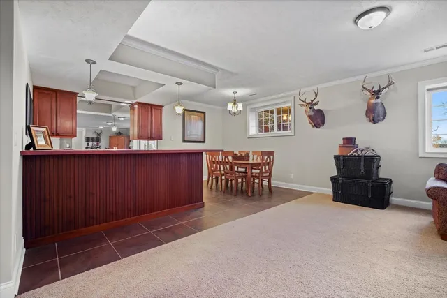 a living room with furniture and a gym