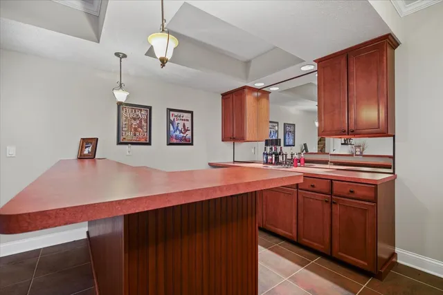a bedroom with a bed a table and dresser
