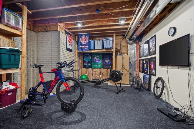 a bathroom with a granite countertop sink a toilet and a mirror