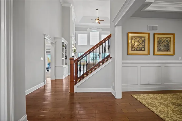 a view of an entryway with wooden floor