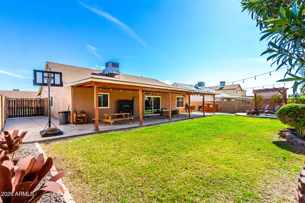 a view of a house with backyard porch and sitting area