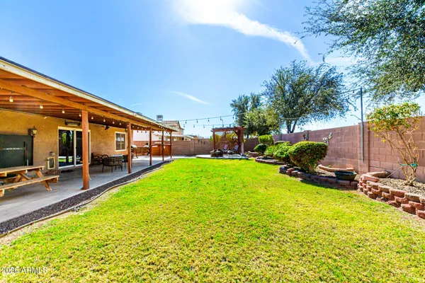 a view of a backyard with a patio