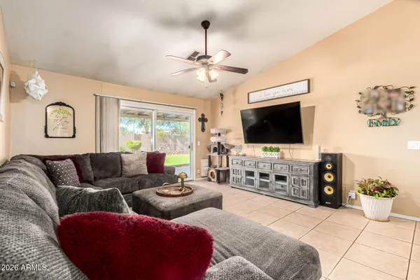 a living room with furniture and a flat screen tv