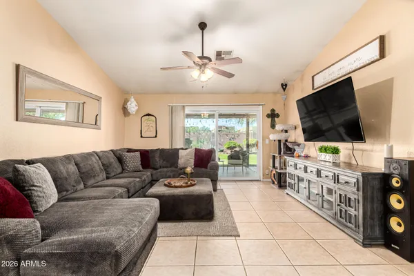 a living room with furniture and a flat screen tv