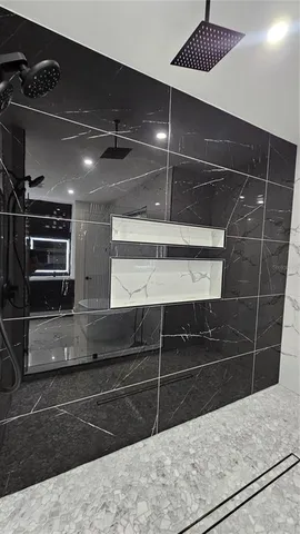 a view of a porch with furniture and a gate