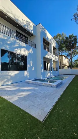 a view of a yard with large tree