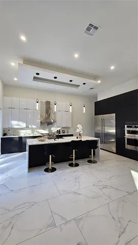a view of a hallway with wooden floor and stairs