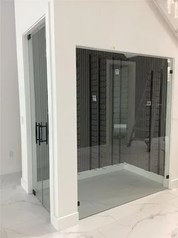 a living room with furniture a window and kitchen view