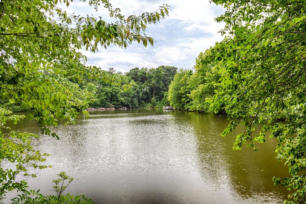 4426 Johnson Street High Point, NC 27265 - Photo 2 of 30 Property includes approx. 1/3 ownership of 4 acre spring-fed lake. Activities galore- fish, swim, kayak, paddleboard, you name it!