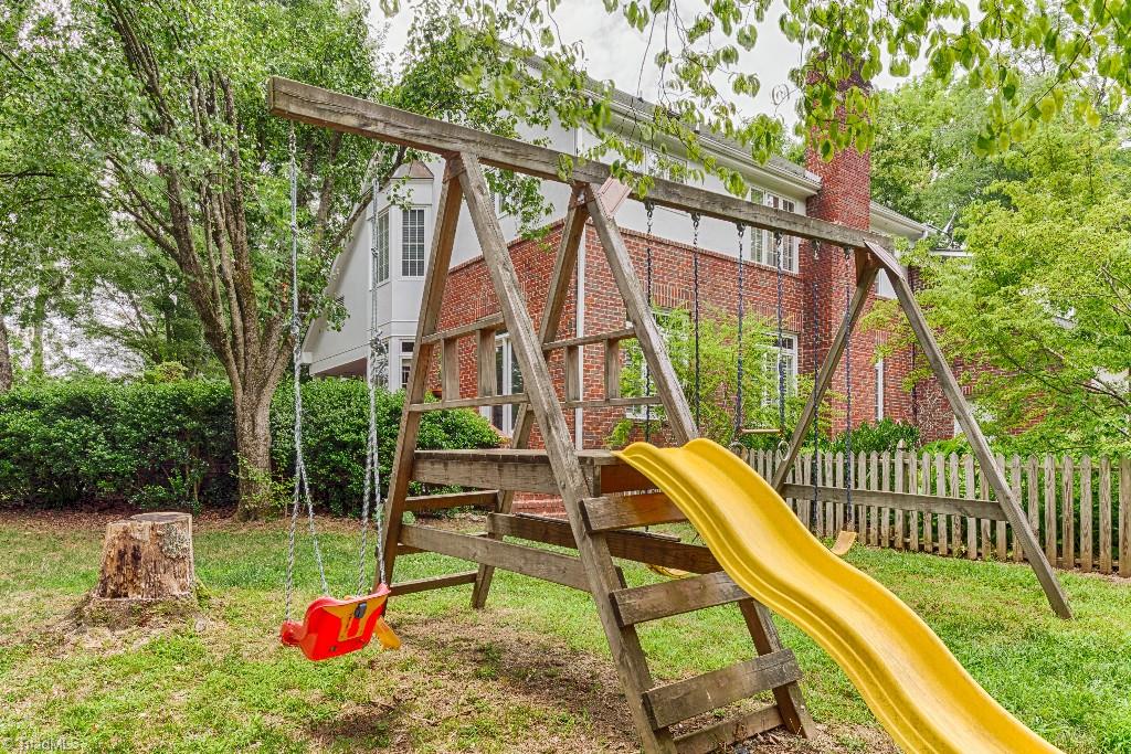 4426 Johnson Street High Point, NC 27265 - Photo 28 of 30 Playset next to the English Garden and pool.