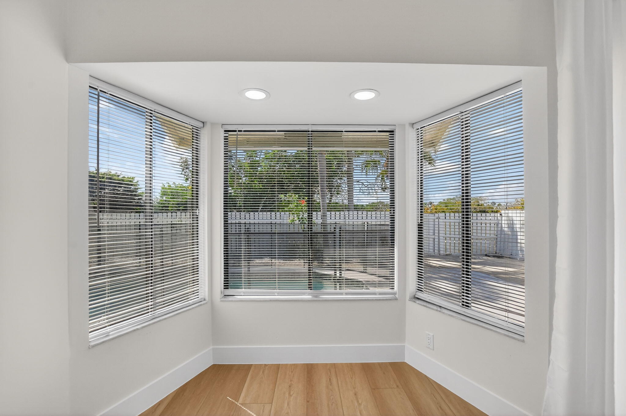 22732 Pickerel Circle Boca Raton, FL 33428 - Photo 16 of 38 a view of empty room with wooden floor and fan