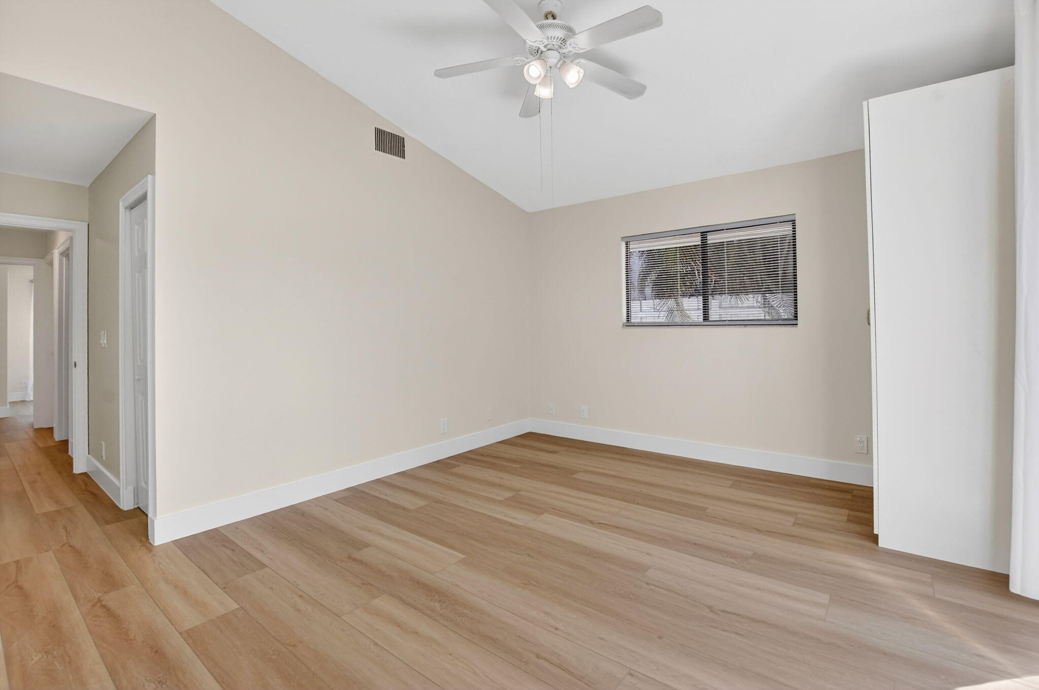 22732 Pickerel Circle Boca Raton, FL 33428 - Photo 22 of 38 a view of an empty room with wooden floor