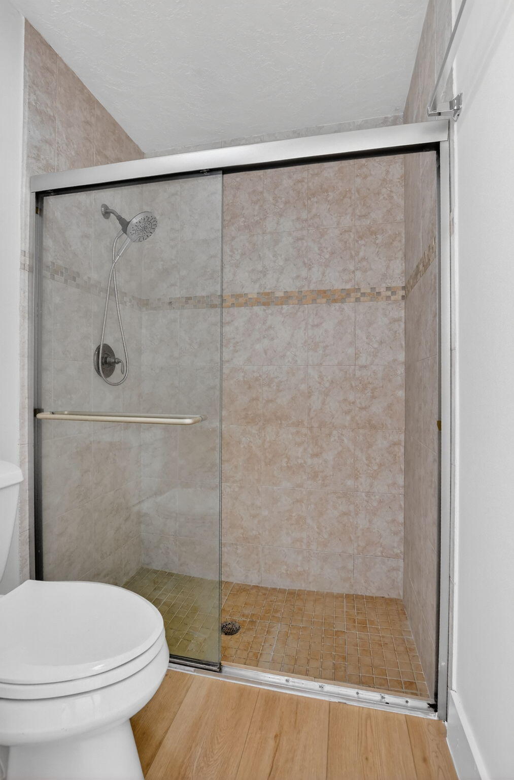 22732 Pickerel Circle Boca Raton, FL 33428 - Photo 24 of 38 a bathroom with a shower and a toilet