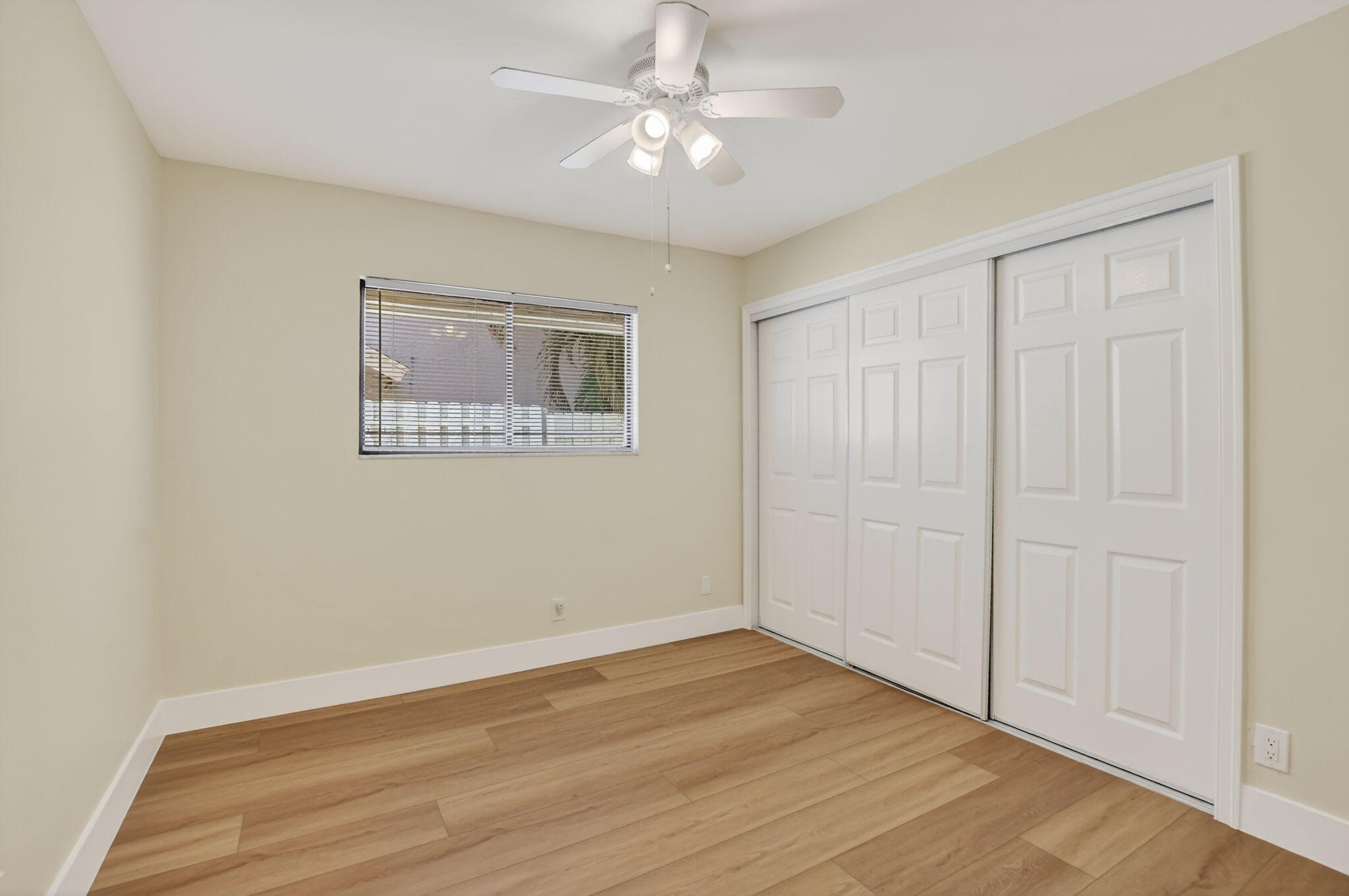 22732 Pickerel Circle Boca Raton, FL 33428 - Photo 30 of 38 a view of an empty room with wooden floor