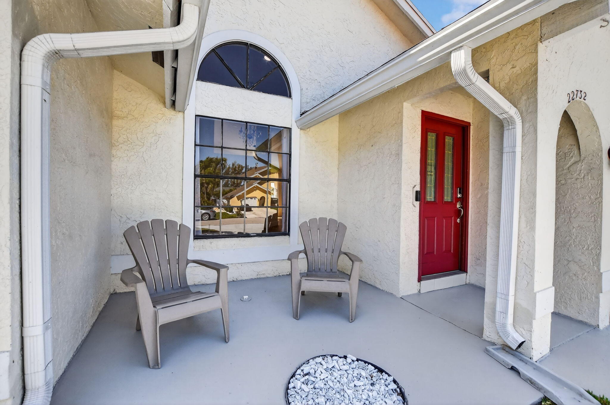 22732 Pickerel Circle Boca Raton, FL 33428 - Photo 5 of 38 a balcony with chairs and a potted plant