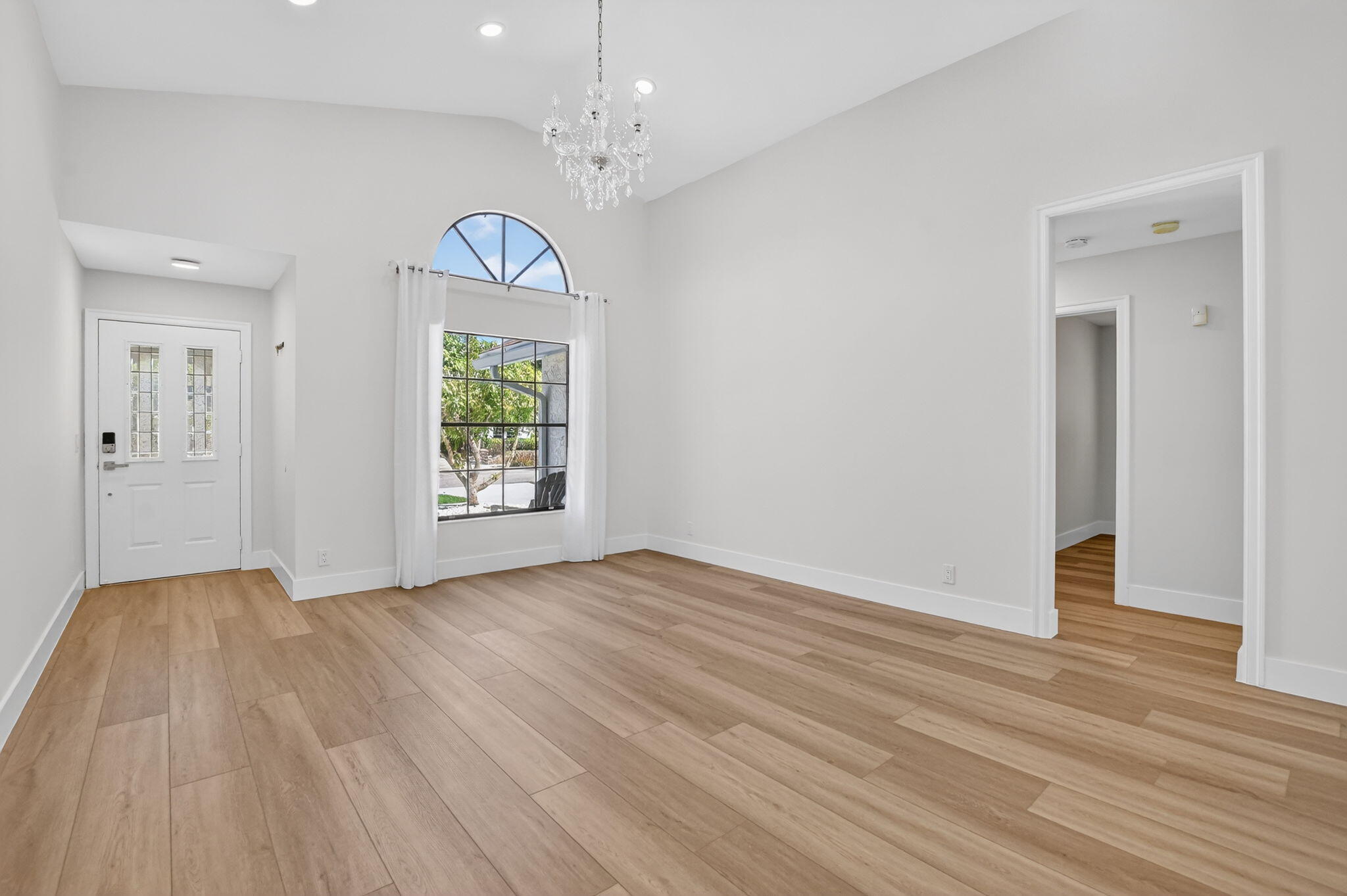 22732 Pickerel Circle Boca Raton, FL 33428 - Photo 10 of 38 wooden floor in an empty room with a window