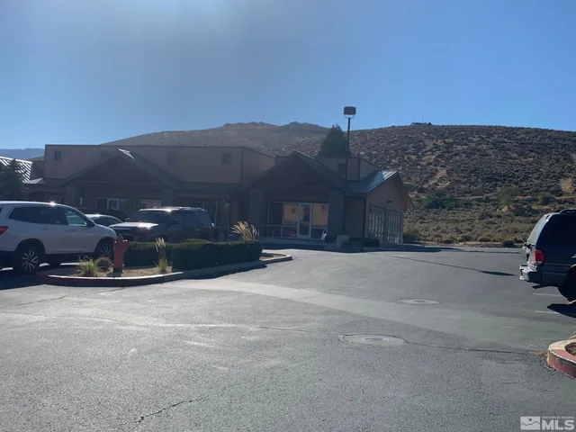 a view of a car parked in front of a house