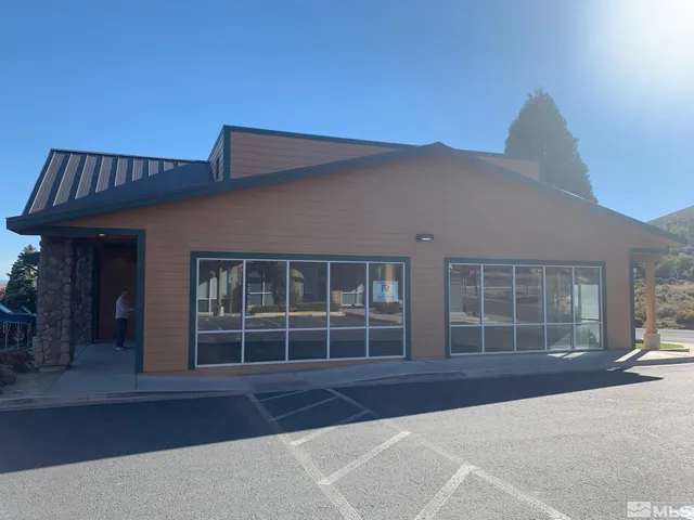 front view of a house with a large window