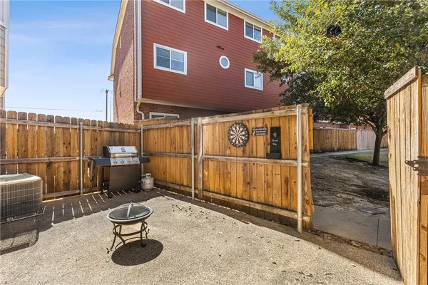 a view of a chairs with wooden fence