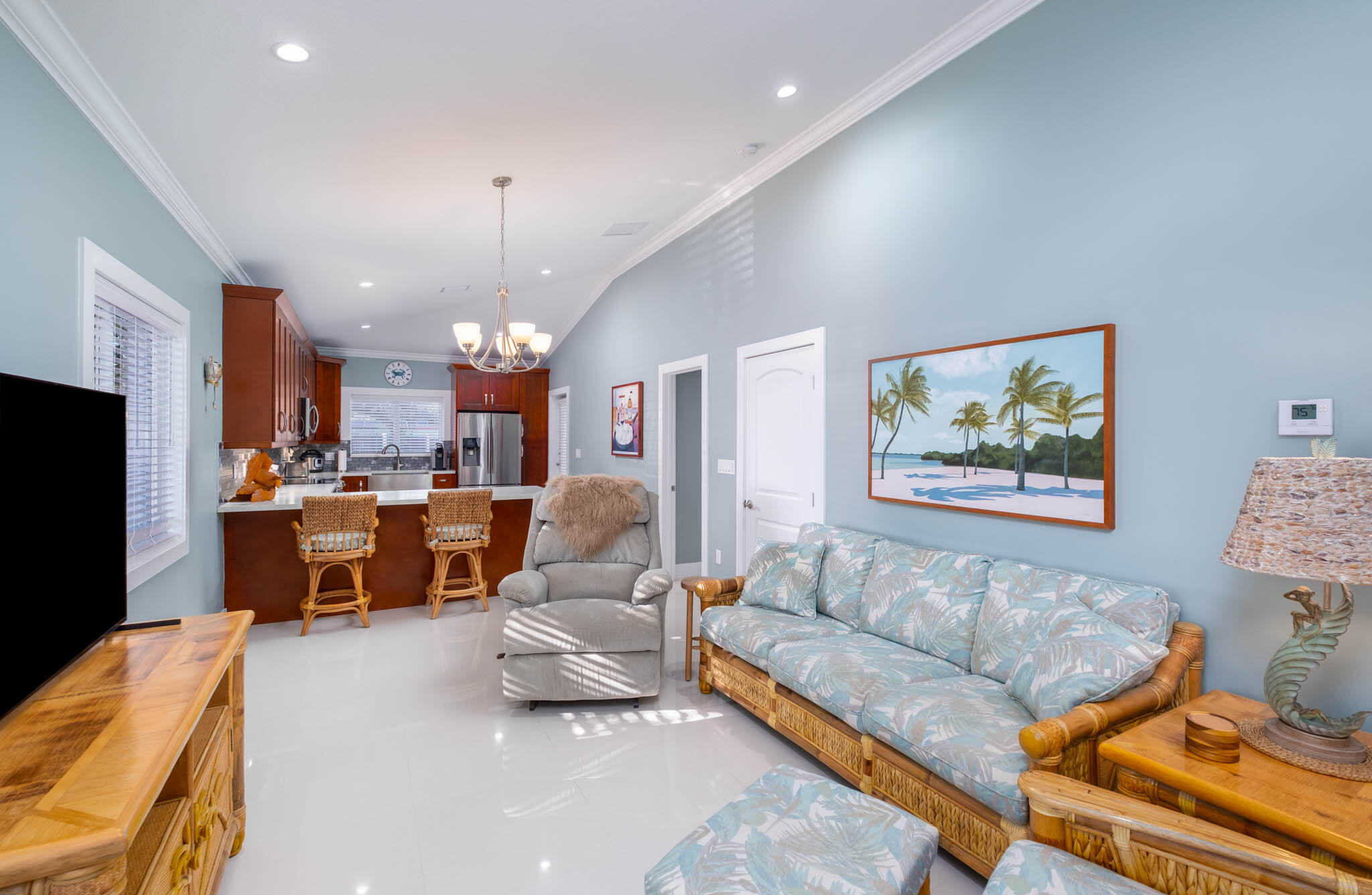 53 Jenny Lane Key Largo, FL 33037 - Photo 5 of 26 a living room with furniture kitchen view and a chandelier