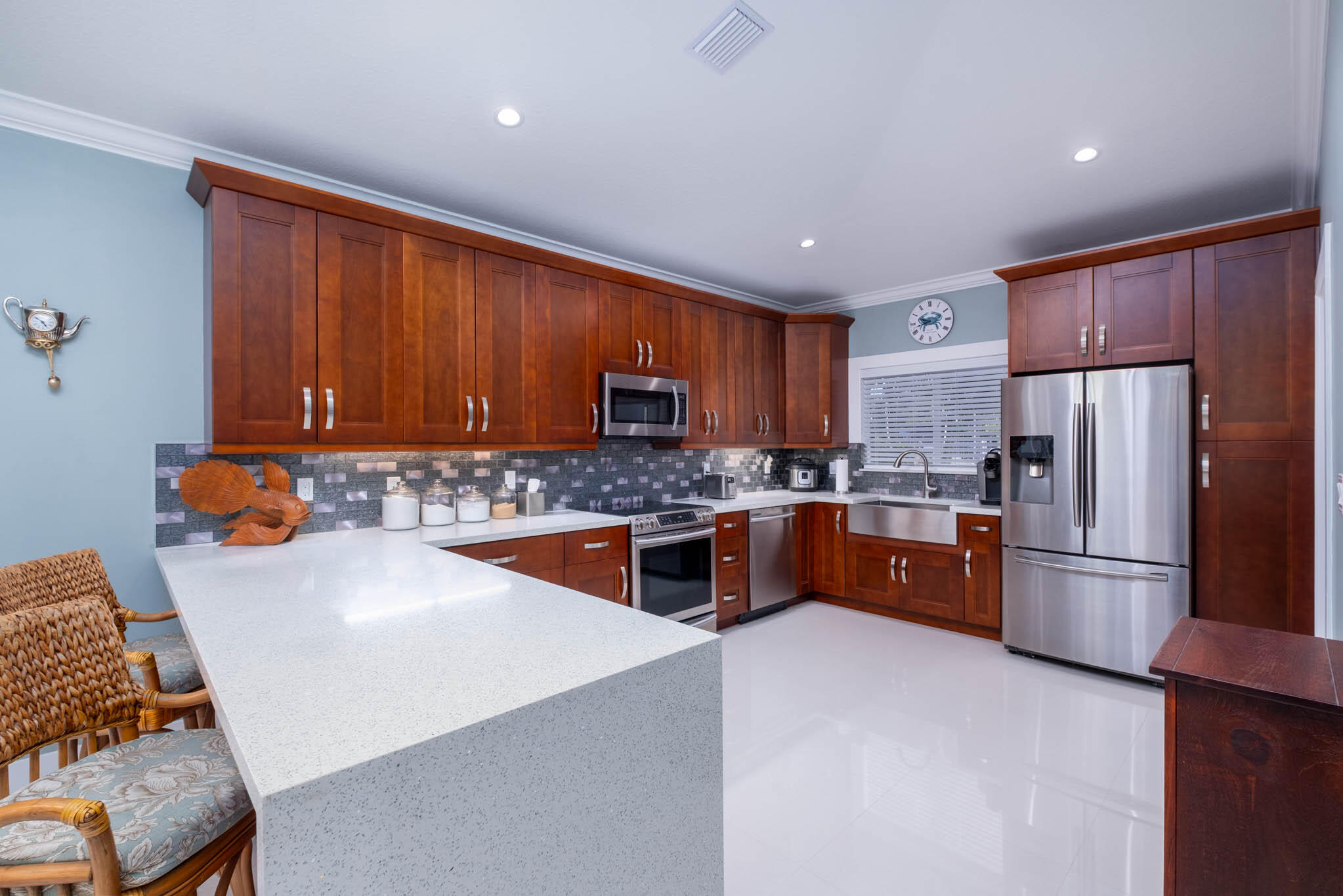53 Jenny Lane Key Largo, FL 33037 - Photo 10 of 26 a kitchen with stainless steel appliances granite countertop a refrigerator stove a sink dishwasher and microwave