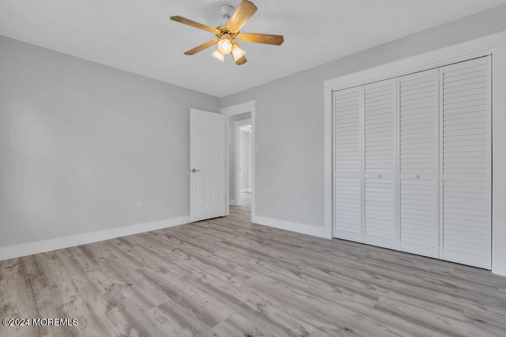 22 Spinnaker Way Waretown, NJ 08758 - Photo 26 of 29 wooden floor in an empty room